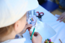 production of badges for children with the populair logo