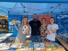 Representatives of the LIFE project in front of project banners together with promotional materials