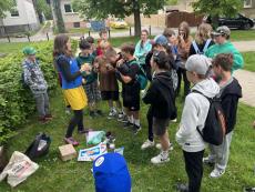 Lecturer with students in park